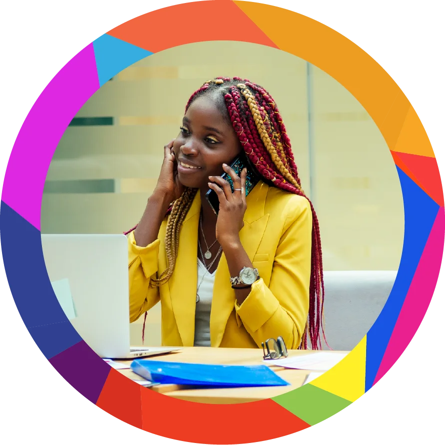 Happy, afro american woman in a stylish yellow jacket and multi-colored dreadlocks